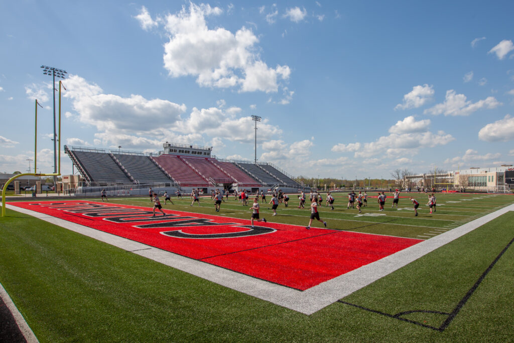 GRC-5|high school tennis courts|high school softball stadium|high school baseball stadium|high school gymnasium seating|high school entryway staircase trophy case|high school football stadium press box|batting cages in multipurpose room|weight training room school||||||||||||||||