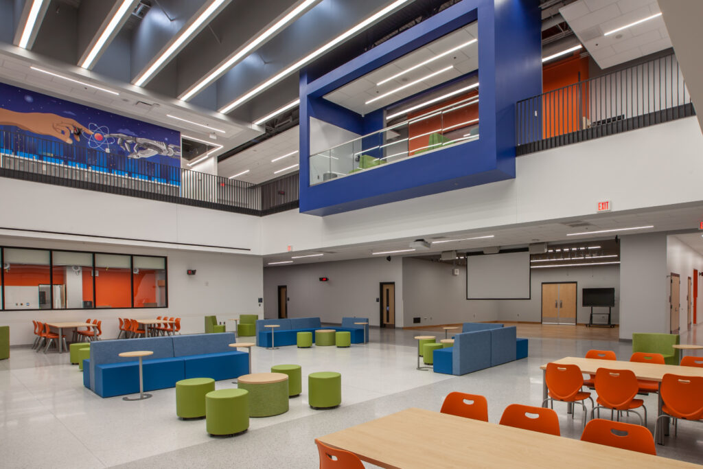 student social area with bright colors and collaborative seating|student classroom with bright colors and collaborative seating|student classroom with bright colors and collaborative seating|student school cafeteria with bright seating|student classroom with bright ceiling decoration green chairs|study room in school with large open windows|success mural in school hallway bright colors|learning area collaboration school bright colors||||||||||||||
