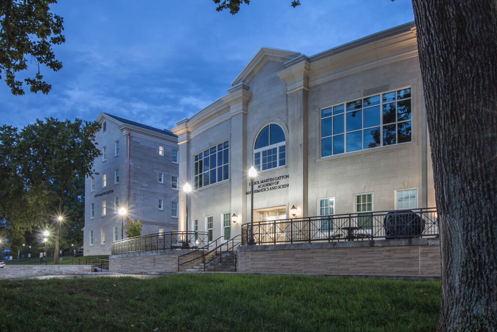 higher education building exterior|college campus dorm residence hall|higher education hallway with piano and seating|higher education large room with round tables||||||