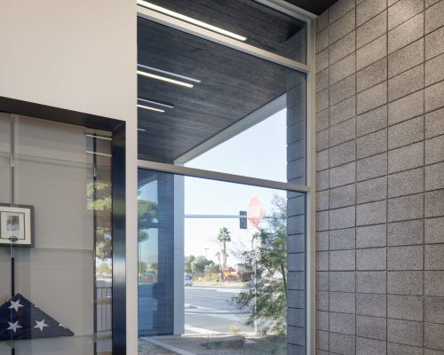 The public entrance lobby at Clark County Fire Station 61 in Las Vegas, NV. Note the burnt wood ceiling, which extends to the exterior as well.