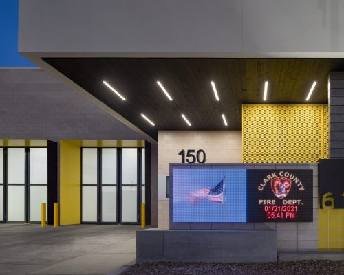 Exterior view of Clark County Fire Station 61 in Las Vegas, NV. Note the burnt wood ceiling, which also continues into the interior lobby.