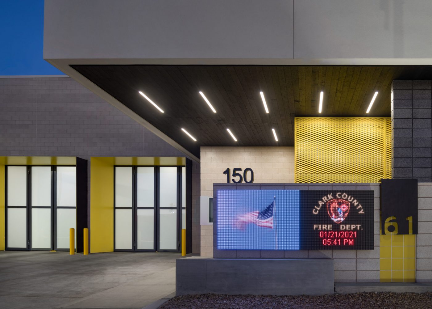Exterior view of Clark County Fire Station 61 in Las Vegas, NV. Note the burnt wood ceiling, which also continues into the interior lobby.
