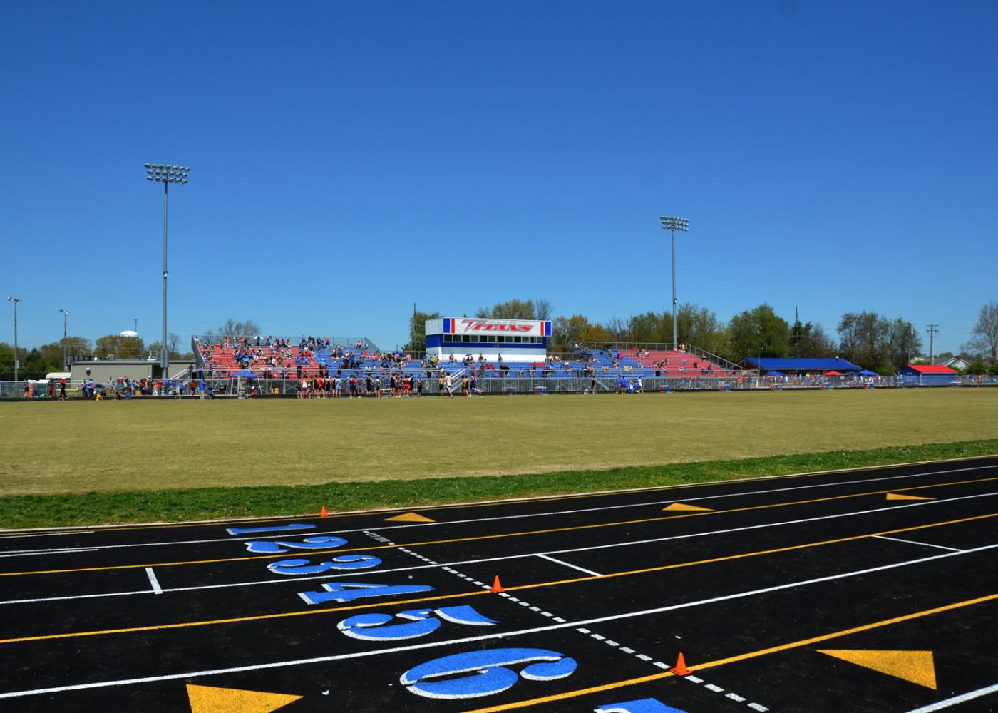 high school track and field fans bleachers|high school sporting event fans in bleachers|high school track and field|high school track and field athletes|high school football field and track|high school football field and track||||||||||