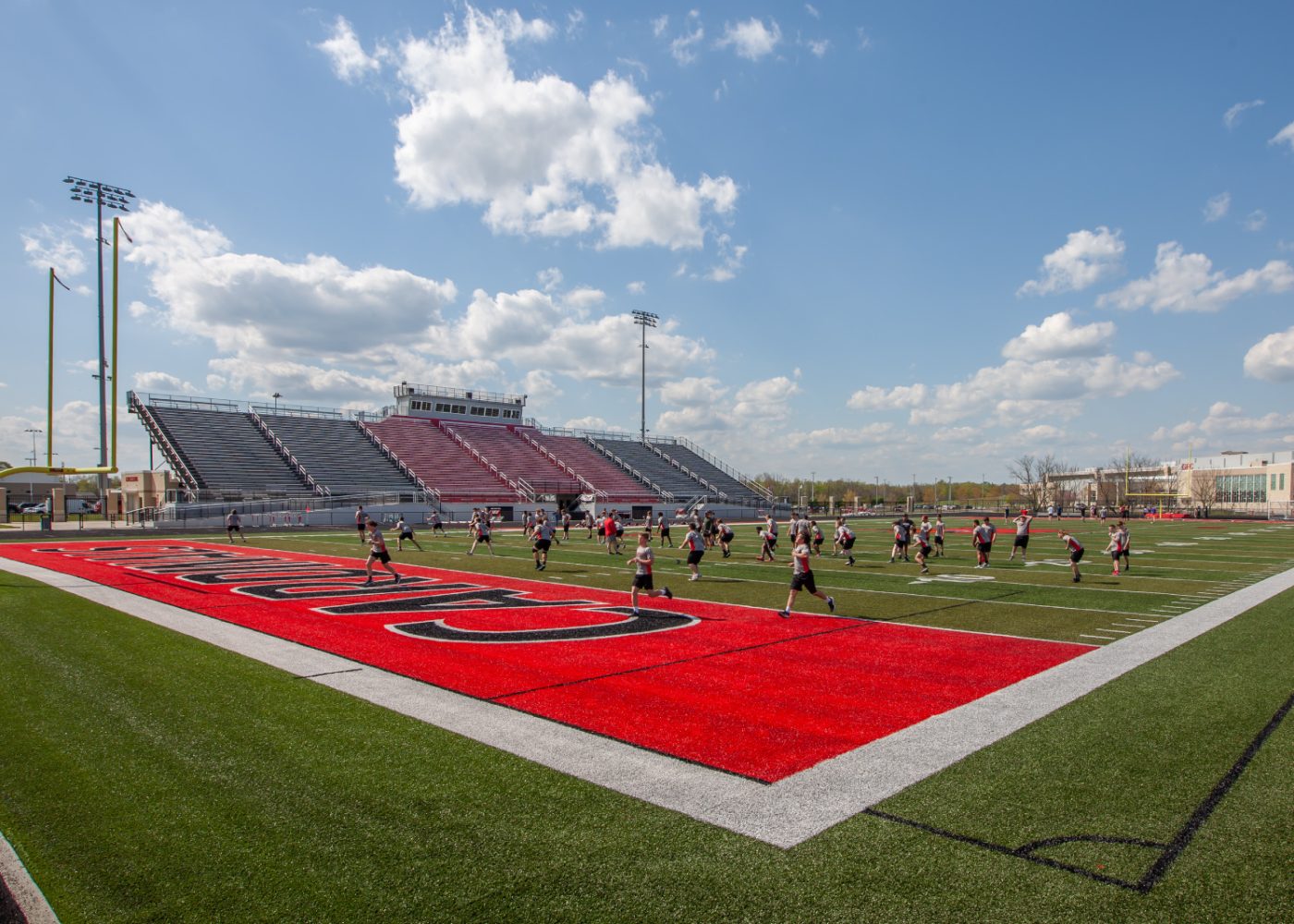 GRC-5|high school tennis courts|high school softball stadium|high school baseball stadium|high school gymnasium seating|high school entryway staircase trophy case|high school football stadium press box|batting cages in multipurpose room|weight training room school||||||||||||||||