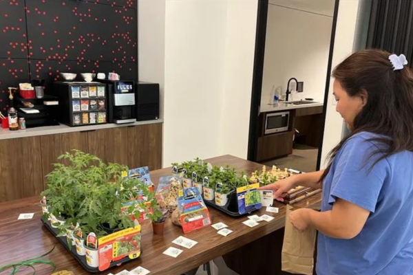 Houston office Earth Day other girl with plants