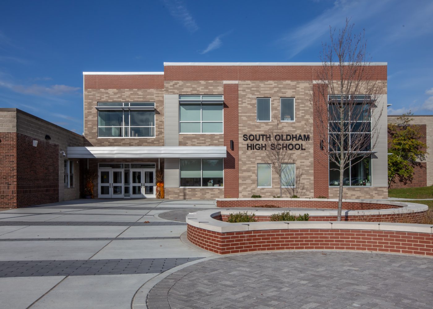 high school exterior building|outside office lobby seating waiting area|education office space|school building trophy case|school front desk welcoming|high school building exterior||||||||||